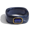 Pulsera rígida de acrílico con cristal azul