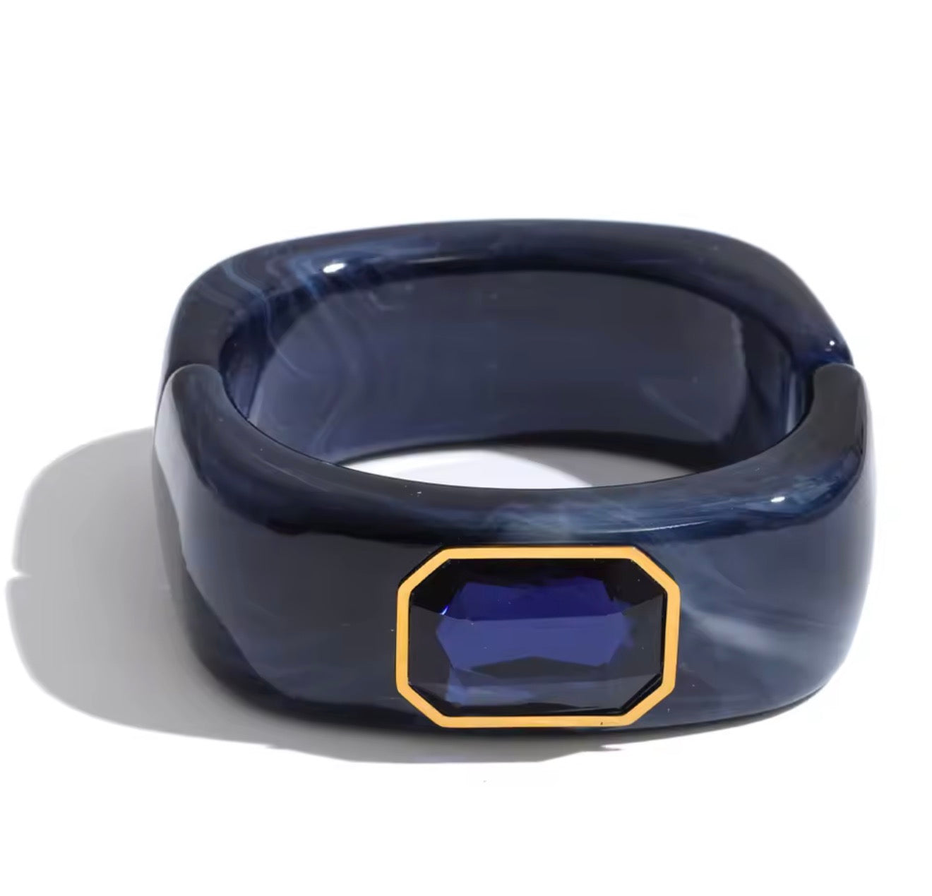 Pulsera rígida de acrílico con cristal azul