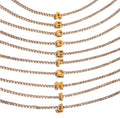 Brazalete de inicial con incrustaciones