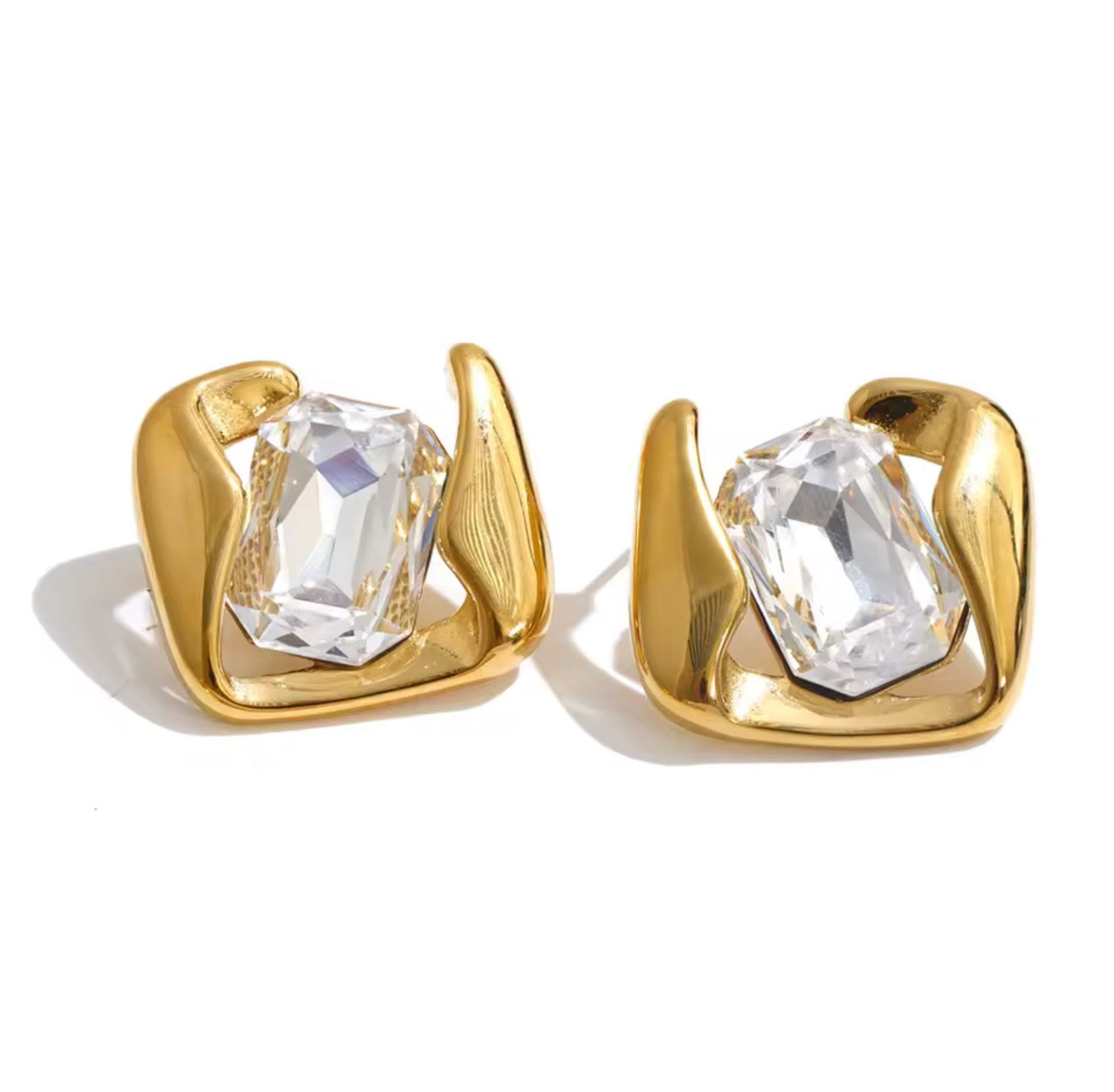 Aretes contorno dorado y cristal central grande