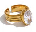 Anillo ajustable con cristal central ovalado dorado