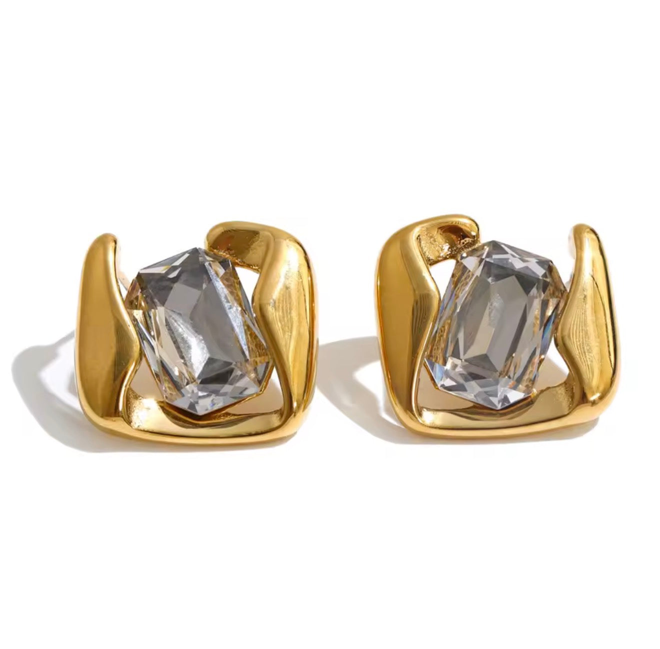 Aretes contorno dorado y cristal central grande