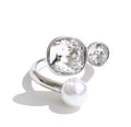 Anillo ajustable con cristales circulares y perla plateado
