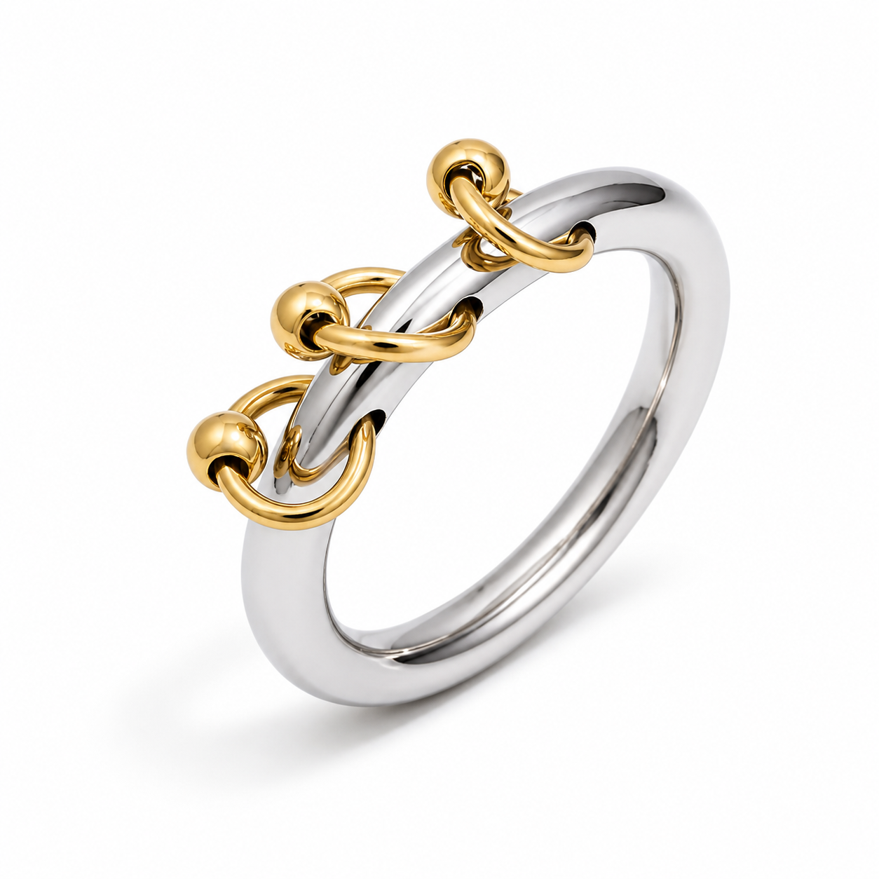 Anillo plateado con aros y cuentas doradas
