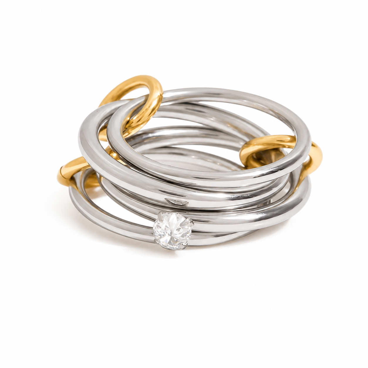 Anillo cuádruple plateada con argollas doradas y centro cristalito